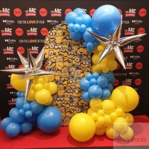 Minions themed sailboard with balloons and silver stars Corporate client ARC Cinema