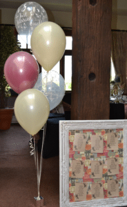 5 balloons on a weight