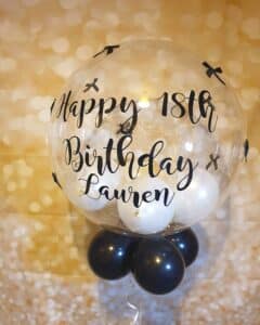 Hepburn style fiesta bubble personalised balloons with black bows
